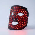 GlowNest black silicone LED face mask glowing red